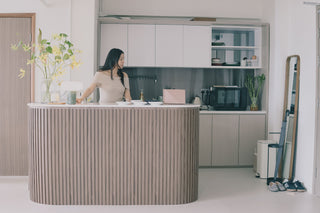 Reception area with a woman standing behind the counter