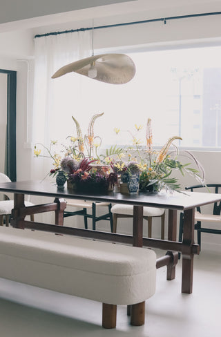 Elegant dining table setup with floral centerpiece