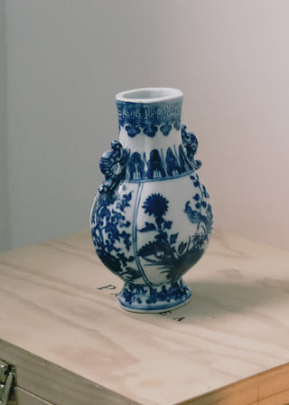 Ornate blue and white porcelain vase with floral patterns